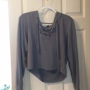 Long sleeved crop top with a hoodie.